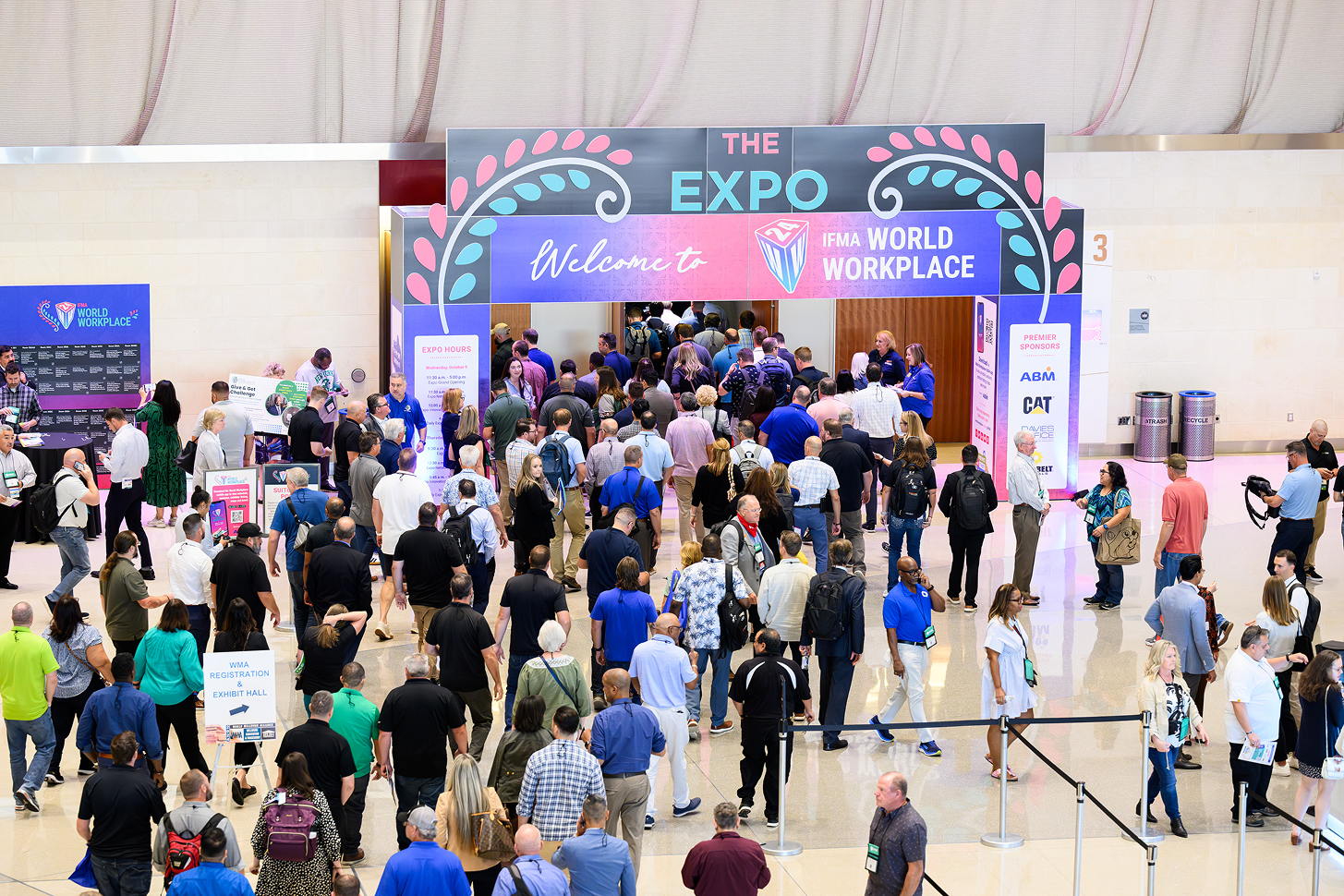 Conference expo floor with attendees